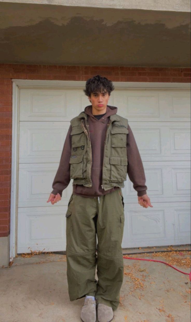 Brown hoodie with olive utility vest, green cargo pants